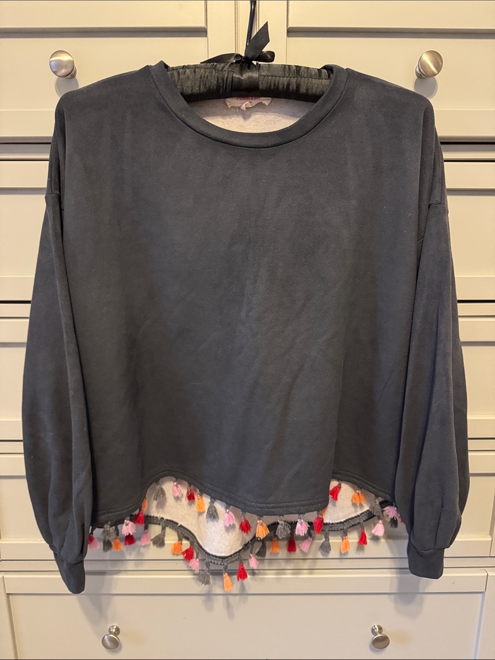 Peach Love California Black Crewneck Sweater with Multicolor Tassel Hem